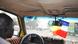 Taxi driver with French and Malian flags hanging at the windshield Taxi driver with French and Malian flags hanging at the windshield