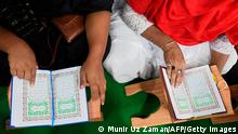 Members of transgender community read the holy Koran inside the Dawatul Islam Tritio Linger Madrasa or the Islamic Seminary for the third gender, in Dhaka on November 6, 2020. (Photo by Munir UZ ZAMAN / AFP) (Photo by MUNIR UZ ZAMAN/AFP via Getty Images)