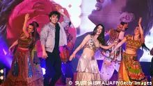 Indian Bollywood actors Warina Hussain (R) and Aayush Sharma dance during the promotion of the upcoming musical romantic drama Hindi film 'Loveyatri' in Mumbai on September 26, 2018. (Photo by Sujit Jaiswal / AFP) (Photo credit should read SUJIT JAISWAL/AFP via Getty Images)