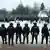 Цепь полицейских напротив протестующих в поддержку Навального в Санкт-Петербурге