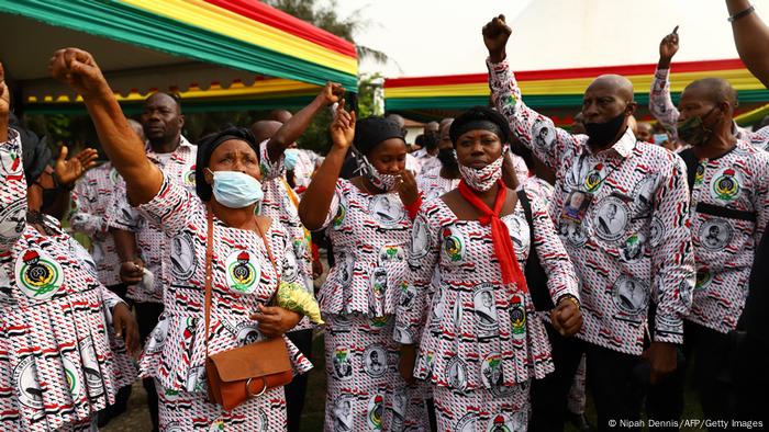 Staff of the former Ghana President Jerry John Rawlings sing at the lay in state in Accra, Ghana