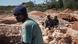 Des mineurs se reposent après avoir travaillé dans une zone de déchets miniers, le 31 mai 2015, alors qu'ils cherchent des restes de cobalt près d'une mine entre Lubumbashi et Kolwezi Des mineurs se reposent après avoir travaillé dans une zone de déchets miniers, le 31 mai 2015, alors qu'ils cherchent des restes de cobalt près d'une mine entre Lubumbashi et Kolwezi