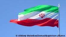 3D rendering of the national flag of Iran waving in the wind against a blue sky