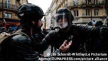 December 12, 2020, Paris, Ile-de-France (region, France: A policeman asks a photojournalist to step back.Thousands of people demonstrated on Saturday, December 12, for the third week in a row in France, without major incidents, to denounce the highly controversial Global Security Law proposal and the government's bill on ''separatism''. Called by a group of left-wing unions, associations and political movements, this new day of mobilization took place under a very strong police presence, particularly in Paris, where numerous units of CRS and mobile gendarmes closely supervised the thousands of people - 10,000 according to the organizers - who were demonstrating from the Place du Chatelet to the Place de la Republique. (Credit Image: © Jan Schmidt-Whitley/Le Pictorium Agency via ZUMA Press