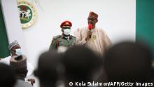 Nigeria's President Muhammadu Buhari (R) speaks during a meeting with the released Kankara schoolboys upon their release in Katsina, Nigeria, on December 18, 2020. - Exhausted and dishevelled, several hundred Nigerian schoolboys seized in a mass abduction claimed by Boko Haram experienced their first full day of freedom on December 18, 2020 after a nearly week-long ordeal. (Photo by Kola Sulaimon / AFP) (Photo by KOLA SULAIMON/AFP via Getty Images)