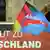 An AfD flag and banner that reads in German: courage to Germany