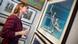 A woman looks at a work of art at the Affordable Art Fair in Paris A woman looks at a work of art at the Affordable Art Fair in Paris