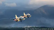 (190731) -- BEIJING, July 31, 2019 (Xinhua) -- Photo taken on Jan. 4, 2019 shows fighter bombers of the Chinese People's Liberation Army (PLA) Navy taking off. (Photo by Nie Haifei/Xinhua)