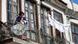 An elderly Syrian lady dries her laundry on her balcony, people in Syria have been suffering from war that the Syrian constituional committee in Geneva seeks to end. An elderly Syrian lady dries her laundry on her balcony, people in Syria have been suffering from war that the Syrian constituional committee in Geneva seeks to end.