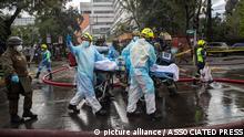 Jan. 30, 2021***
Health workers evacuate a COVID-19 patient from a fire inside a San Borja Arrarian hospital in Santiago, Chile, Saturday, Jan. 30, 2021. (AP Photo/Esteban Felix)