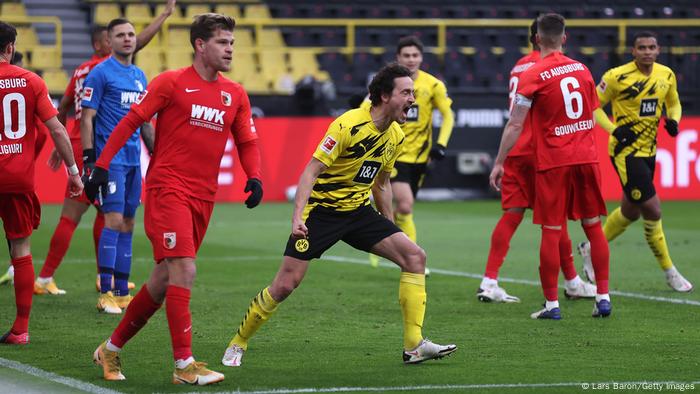 Thomas Delaney (middle) elates after scoring the equalizer