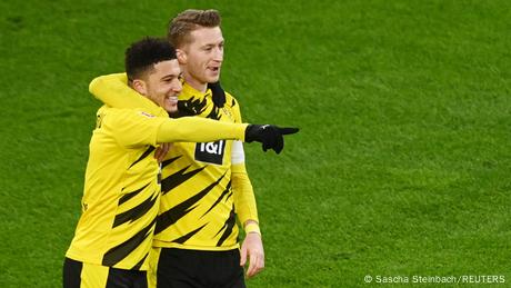 Jadon Sancho (left) and Marco Reus (right) smile after Sancho's second-half goal Jadon Sancho (left) and Marco Reus (right) smile after Sancho's second-half goal