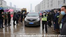 Members of World Health Organizaion (WHO) visit an imported seafood market to investigae into an outbreak of a potentially deadly lung virus, a new coronaviruus in Wuhan, Hubei Province, China on Jan.31, 2021. WHO probe team has continued tol tackle to probe into the origins of the Covid-19 pandemic. ( The Yomiuri Shimbun via AP Images )