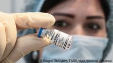 MOSCOW REGION, RUSSIA - JANUARY 21, 2021: A medical worker holds an ampoule with the first component of the Gam-COVID-Vak (Sputnik V) vaccine during a COVID-19 vaccination campaign at the Mega Khimki shopping center. Sergei Bobylev/TASS