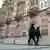 Police officers walk near the US embassy in Moscow