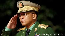 FILE PHOTO: Myanmar Commander in Chief Senior General Min Aung Hlaing salutes as he attends an event marking the anniversary of Martyrs' Day at the Martyrs' Mausoleum in Yangon July 19, 2016. REUTERS/Soe Zeya Tun/File Photo