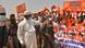 Chad's President Idriss Deby Itno waves to supporters as bodyguards look on. Chad's President Idriss Deby Itno waves to supporters as bodyguards look on.