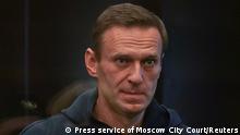 Russian opposition leader Alexei Navalny, accused of flouting the terms of a suspended sentence for embezzlement, attends a court hearing in Moscow, Russia February 2, 2021. Press service of Moscow City Court/Handout via REUTERS ATTENTION EDITORS - THIS IMAGE HAS BEEN SUPPLIED BY A THIRD PARTY. NO RESALES. NO ARCHIVES. MANDATORY CREDIT. THIS IMAGE WAS PROCESSED BY REUTERS TO ENHANCE QUALITY, AN UNPROCESSED VERSION HAS BEEN PROVIDED SEPARATELY.