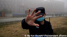 03.02.2021
A security person moves journalists away from the Wuhan Institute of Virology after a World Health Organization team arrived for a field visit in Wuhan in China's Hubei province on Wednesday, Feb. 3, 2021. The WHO team is investigating the origins of the coronavirus pandemic has visited two disease control centers in the province. (AP Photo/Ng Han Guan)