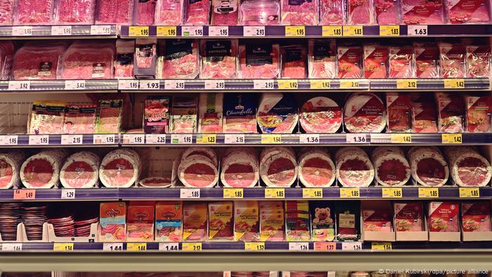 A supermarket shelf of packaged cold cuts