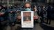 A protester holds up a picture of Lokman Slim after he was found dead in his car A protester holds up a picture of Lokman Slim after he was found dead in his car