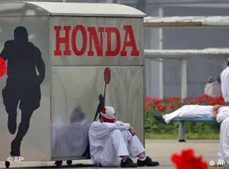 In this photo taken Thursday, May 27, 2010, Chinese workers gather on the basketball court at the Honda Auto Parts Manufacturing Plant at Nanhai in Foshan in south China's Guangdong province. Honda Motor Co. says it will resume production Friday, June 4, 2010 at four assembly plants in China after striking employees at a key parts factory agreed to a pay raise but said some want more money and might walk out again. (AP Photo) ** CHINA OUT **