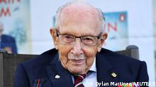 FILE PHOTO: Captain Sir Tom Moore smiles as he launches his autobiography book 'Tomorrow will be a Good Day' at his home in Milton Keynes, Britain September 17, 2020. REUTERS/Dylan Martinez/File Photo