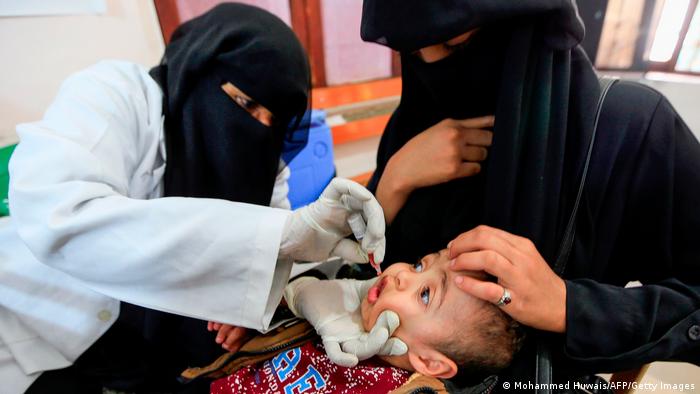 A Yemeni child receives a polio vaccination during an immunisation campaign at a health clinic in the capital Sanaa