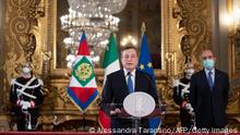 Former head of the BCE (European Central Bank) Mario Draghi (C) gives a press conference after a meeting with the Italian president, at the Quirinal palace in Rome, on February 3, 2021. - Italy's president is expected February 3, to ask Mario Draghi, the former head of the European Central Bank, to lead the country out of the devastating coronavirus pandemic after the coalition government collapsed. He called for unity after being charged by Italy's president to form a new government, saying the country faced a difficult moment. (Photo by Alessandra TARANTINO / POOL / AFP) (Photo by ALESSANDRA TARANTINO/POOL/AFP via Getty Images)