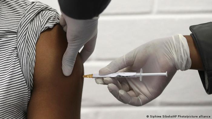 A vaccine volunteer receives an injection at the Chris Hani Baragwanath hospital in Soweto