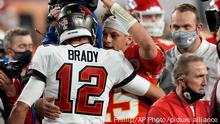 Tampa Bay Buccaneers quarterback Tom Brady embraces Kansas City Chiefs quarterback Patrick Mahomes after the NFL Super Bowl 55 football game, Sunday, Feb. 7, 2021, in Tampa, Fla. The Tampa Bay Buccaneers win 31-9. AP Photo/David J. Phillip)