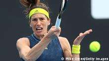 MELBOURNE, AUSTRALIA - FEBRUARY 08: Andrea Petkovic of Germany plays a forehand in her Women's Singles first round match against Ons Jabeur of Tunisia during day one of the 2021 Australian Open at Melbourne Park on February 08, 2021 in Melbourne, Australia. (Photo by Mike Owen/Getty Images)