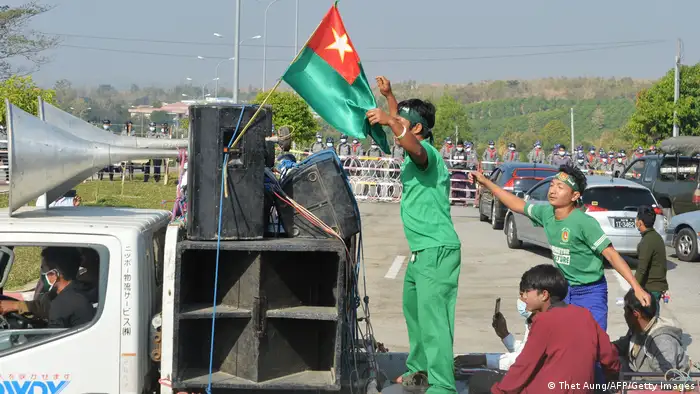 Pro-military demonstrators on the back of a flatbed truck in Naypyitaw
