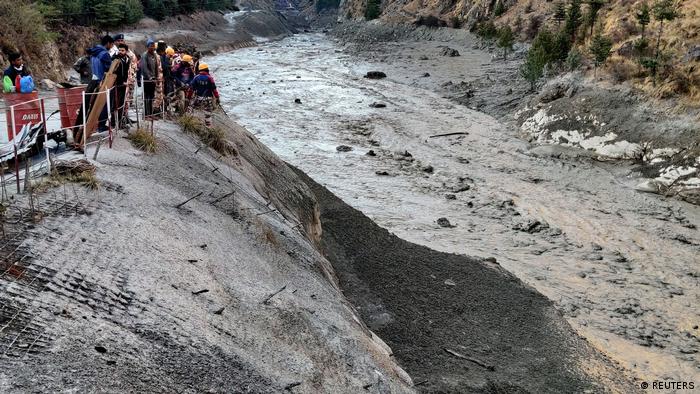 Officials searching for survivors after a Himalayan glacier broke and swept away a dam