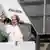 Pope waving as he gets on the plane to Cyprus