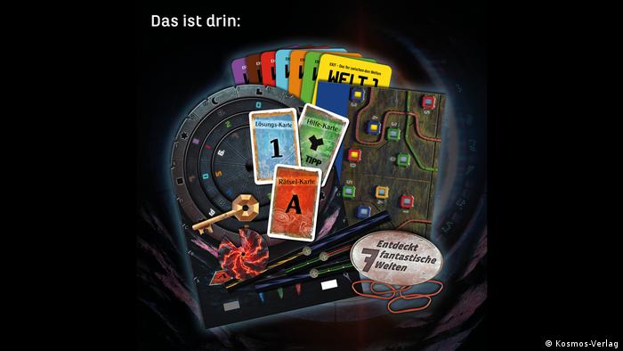  A photo shows the contents of an Exit game box, including game board and card