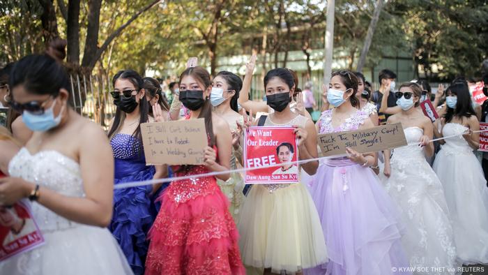 Protesters in ball gowns