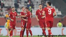 Bayern's Benjamin Pavard, second left, celebrates after scoring his side's opening goal during the Club World Cup final soccer match between FC Bayern Munich and Tigres at the Education City stadium in Al Rayyan, Qatar, Thursday, Feb. 11, 2021. (AP Photo)