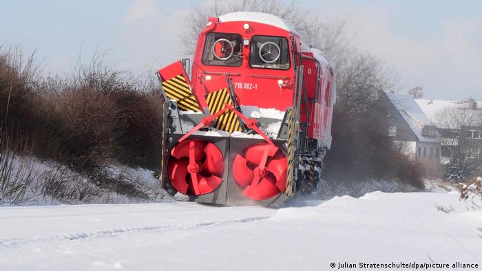 Deutsche Bahn engine clearing the tracks from snow
