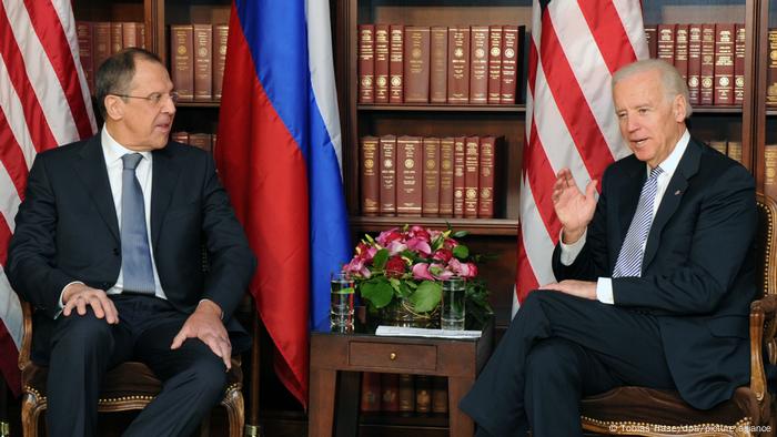 Rusisian Foreign Minister Sergey Lavrov (L) and US then-Vice President Joe Biden talk during bilateral talks at the 49th Munich Conference on Security Policy in Munich, Germany, February 2, 2013.