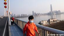 February 13, 2021***
WUHAN, CHINA - FEBRUARY 13: (CHINA OUT) The man wear the mask while walking on the Yangtze River Bridge
during the second day of the Spring Festival on February 13, 2021 in Wuhan, Hubei Province, China. China is marking the Spring Festival which begins with the Lunar New Year on February 12, ushering in the Year of the Ox. (Photo by Getty Images)