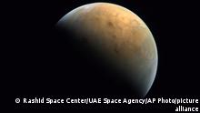 This Feb. 10, 2021 image taken by the United Arab Emirates' Amal, or Hope, probe was released Sunday, Feb. 14, 2021, shows Mars . The Hope space probe now circles the red planet. (Mohammed bin Rashid Space Center/UAE Space Agency, via AP)