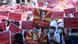 Protesters in Myanmar hold up red placards, some depicting the detained civil leader Aung Suu Kyi Protesters in Myanmar hold up red placards, some depicting the detained civil leader Aung Suu Kyi