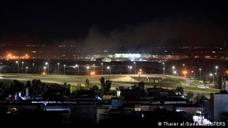 In this photo from February 2021, smoke rises after mortar shells landed near Erbil airport