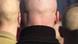 Neo-Nazi skinhead pictured from behind Neo-Nazi skinhead pictured from behind