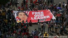 Demonstrators display a banner with an image of deposed Myanmar leader Aung San Suu Kyi during a protest against the military coup in Yangon, Myanmar, Wednesday, Feb. 17, 2021. The U.N. expert on human rights in Myanmar warned of the prospect for major violence as demonstrators gather again Wednesday to protest the military's seizure of power. (AP Photo)
