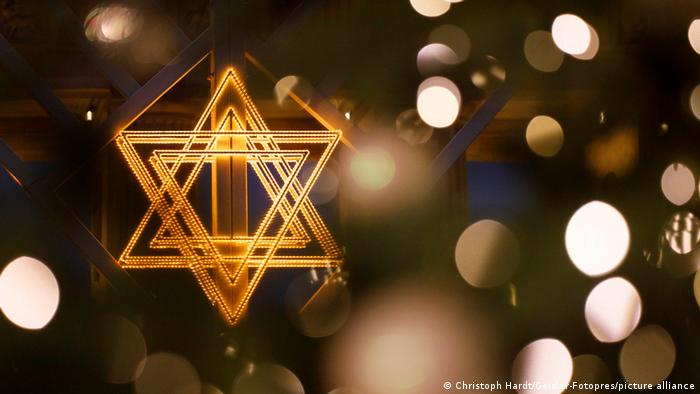 A lit Star of David 