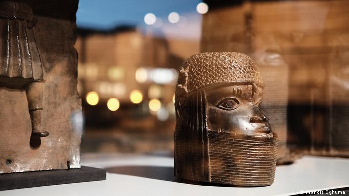 A Benin bronze art object, head in an exhibition context