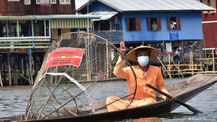 Myanmar protester on boat in Inle 