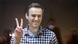 Alexei Navalny makes a peace sign while in court in Moscow, Russia Alexei Navalny makes a peace sign while in court in Moscow, Russia